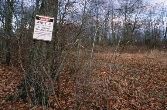 A sign warning of asbestos contamination